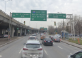 Turn instructions and a wayfinder on a major road in Montreal. Adding a wayfinder in this case is not recommended, but the turns should be implemented with turn instructions that indicate the cardinal direction.